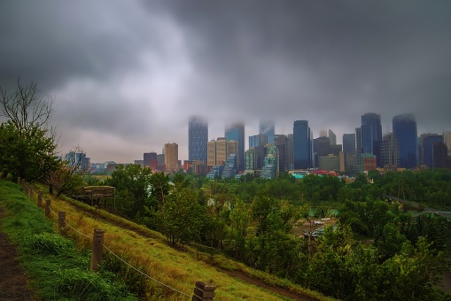 A panoramic cloudy sky over the downtown Calgary skyline in the summer.