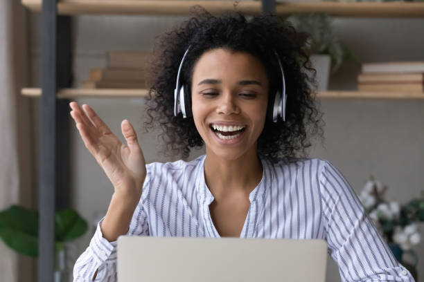 istock Overjoyed African American woman talk on webcam call 1332387174
