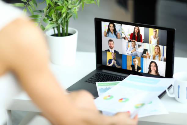 istock Woman talking with international colleagues using online video chat service 1332388287