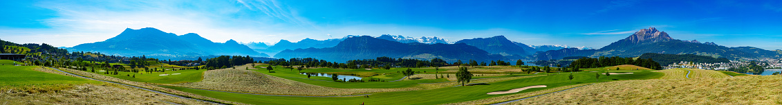 Panorama of mount Rigi and Pilatus with view of golf course in Meggen, Switzerland.