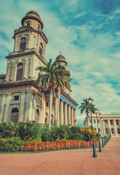 Old cathedral of managua with blue sky, close up of an old cathedral next to lanterns around Old cathedral of managua with blue sky, close up of an old cathedral next to lanterns around nicaragua stock pictures, royalty-free photos & images