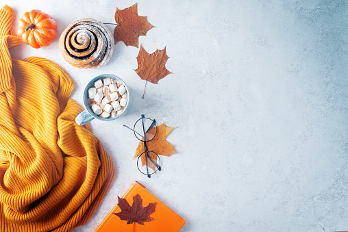 Autumn flat lay with a blanket, hot chocolate and a cake. tinting. selective focus