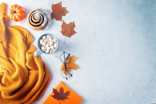 Photo of Autumn flat lay with a blanket, hot chocolate and a cake