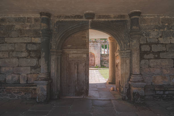 An old medieval archway portal gate door at the historic country manor on the Godolphin Estate at Helston, Cornwall, England, UK.