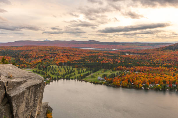 Lyster lake with forest of Quebec and Vermont view from the Mount Pinacle in Coaticook during autumn.