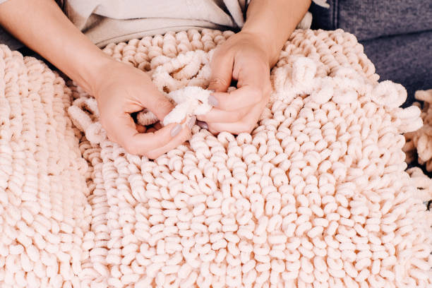 istock Knits made from thick soft yarn. Soft knitted cushions made of thick yarn. 1332401859