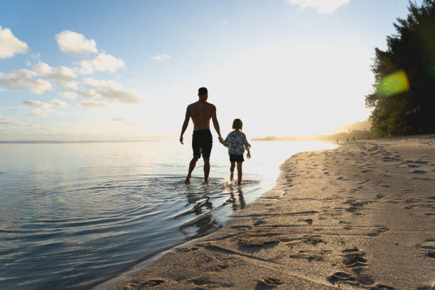 istock Father Daughter Walking Silhouette 1332401861