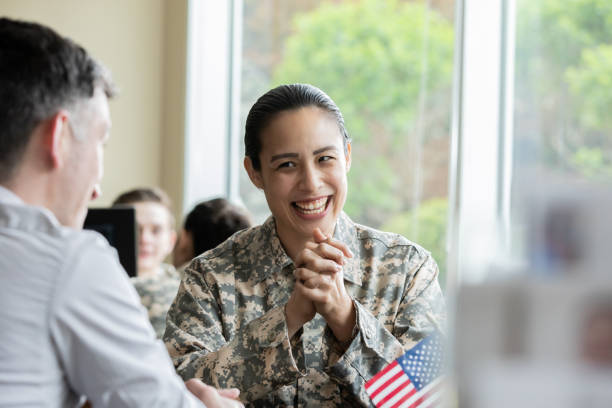 istock Mature female laughing while speaking with financial planner. 1332401913
