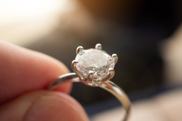istock hand hold beautiful jewelry diamond ring 1332402303