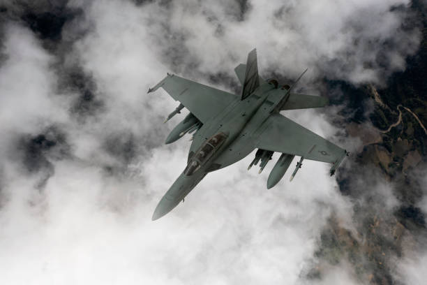 istock Jet fighters flying over the clouds. 1332403220