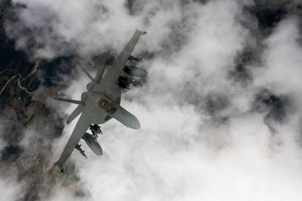 istock Jet fighters flying over the clouds. 1332403839