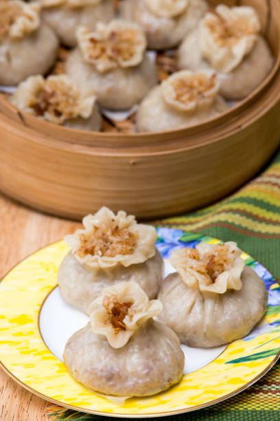 istock Steamed meat and rice stuffed shumai on breakfast table 1332404782