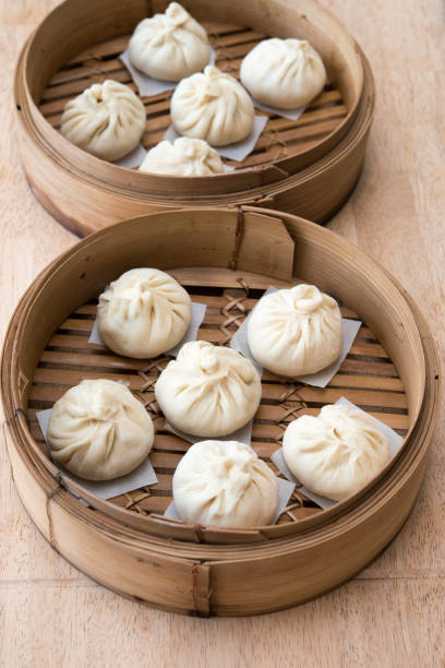 istock Steamed meat stuffed baozi (buns) in bamboo steamer 1332404794