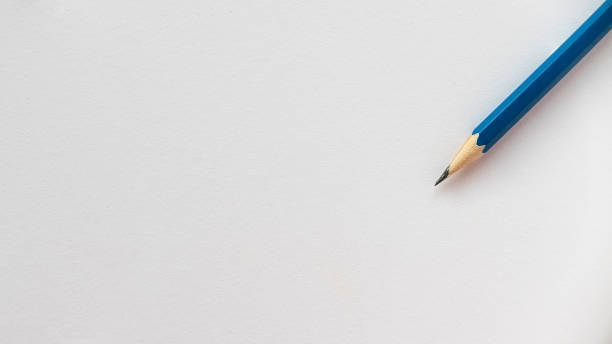 istock Blue pencil isolated on a blank white paper with copy space. 1332406287