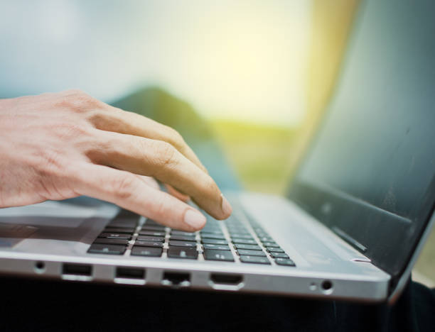 istock hands on laptop keyboard, close up of hands on keyboard 1332410578