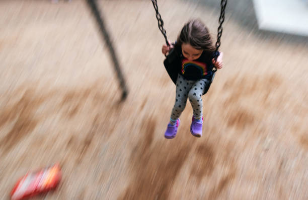 istock Girl Enjoys Swinging 1332417047