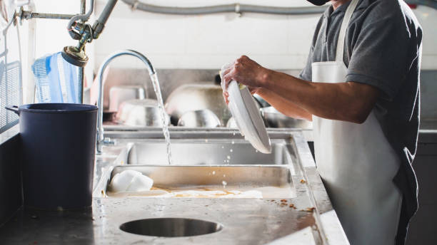 istock Washing dish in sink at restaurant 1332418626
