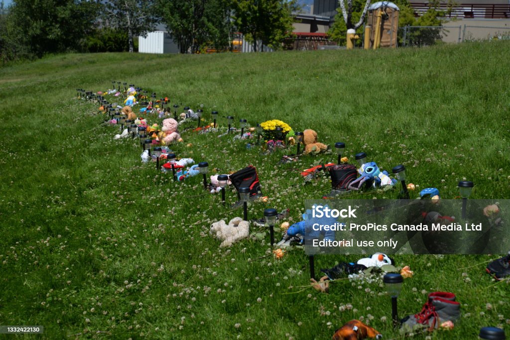 Kamloops Indian Residential School and Memorial Site of 215 Children in mass grave. Kamloops Indian Residential School buildings, property, ceremonial drum circle, memorials, complex, property and signs. Boarding School Stock Photo