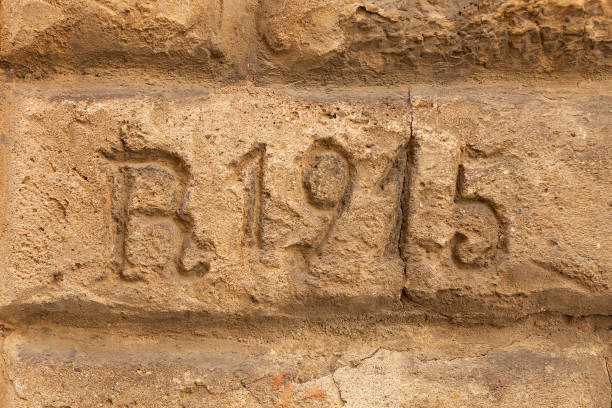 istock Date inscription carved into sandstone block 1332423907