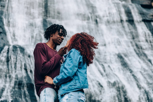 istock Romantic couple at waterfall 1332430195