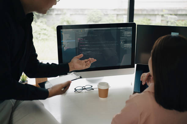 istock Team of programmers working on new project together in office. 1332431355