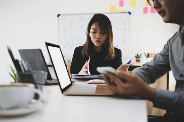 istock Business people working together on project at modern workplace. 1332431371