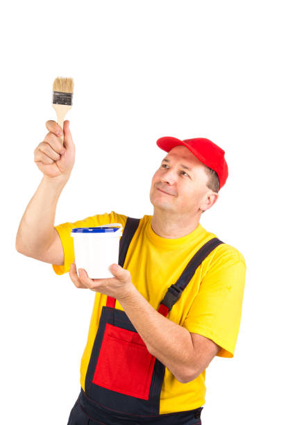 Painter with a bucket of paint and a brush.