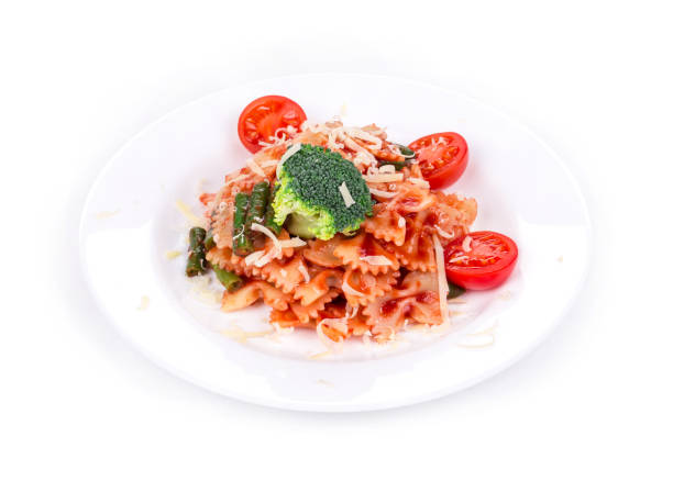 istock Farfalle pasta with tomatoes and broccoli. 1332433142