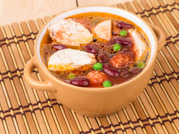 istock Fresh vegetable soup with chicken and red beans. 1332433482