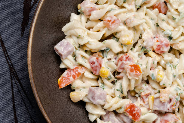 istock Pasta salad on a plate close-up background 1332435558