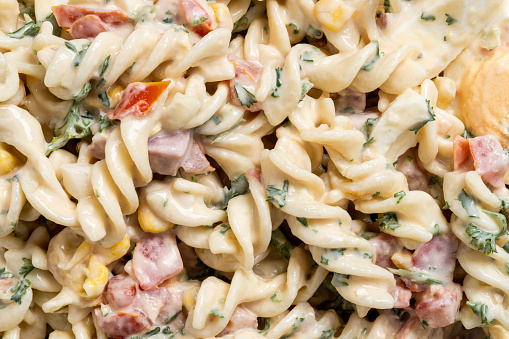 Close-up of pasta salad.\nShot with a 35-mm full-frame 61MP Sony A7R IV with FE 90mm F2.8 Macro-lens.
