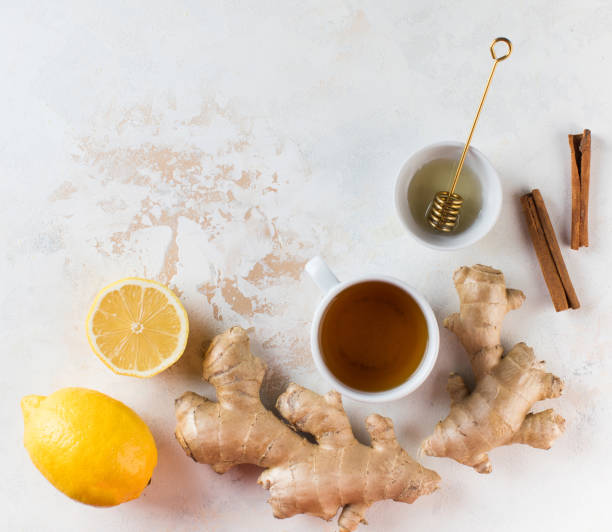 istock Flatlay tea, lemon and ginger. The concept of autumn warming tea. Copy space. 1332437002