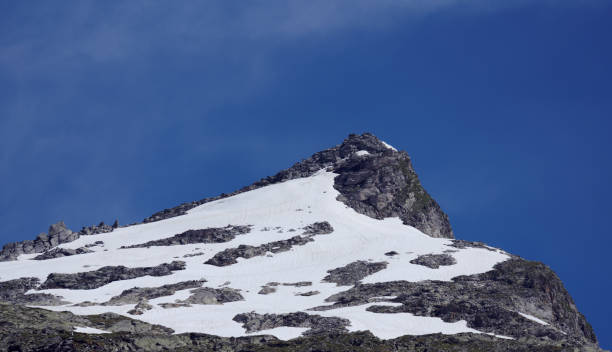 istock Scenic view of mountain against clear blue sky 1332439820