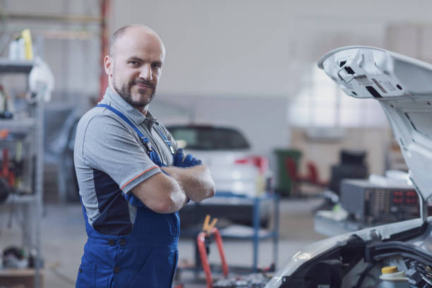 istock Professional mechanic posing in the workshop 1332442735