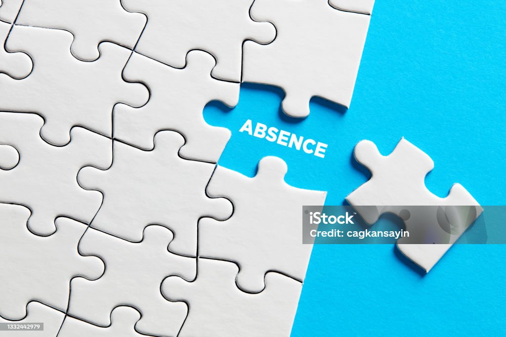 The word absence on missing puzzle piece. The word absence on missing puzzle piece. Business concept. Absence Stock Photo
