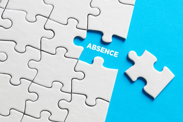 The word absence on missing puzzle piece. The word absence on missing puzzle piece. Business concept. abandoned stock pictures, royalty-free photos & images