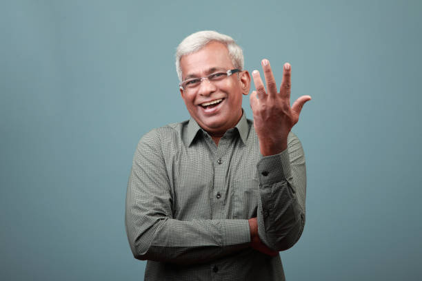 istock Elderly man of Indian ethnicity with a laughing expression 1332446516