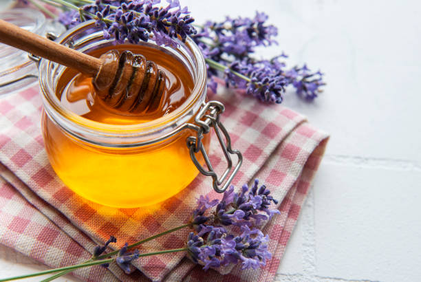 istock Jar with honey and fresh lavender flowers 1332446622