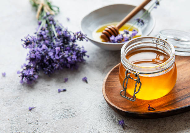 istock Jars with honey and fresh lavender flowers 1332446624
