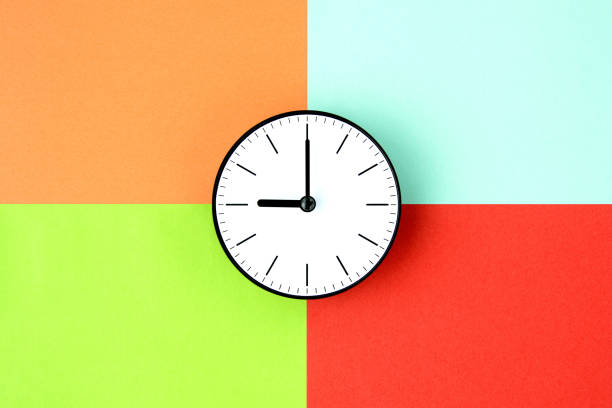 Clock on various color background stock photo