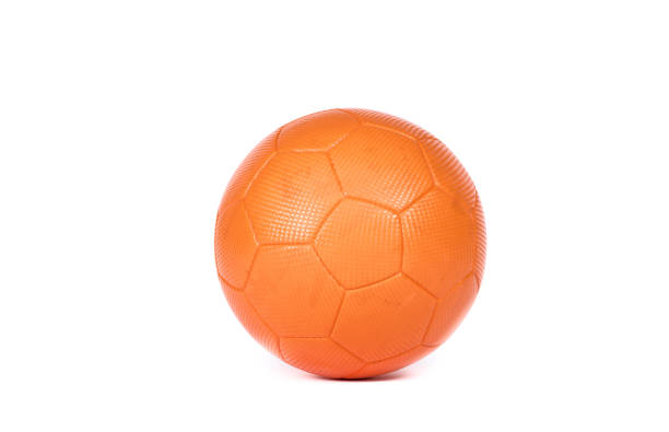 Orange futsal soccer ball with hexagon structure isolated on white background