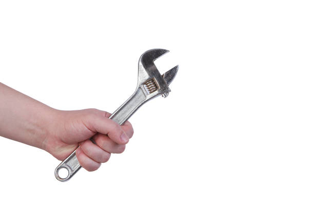 istock A hand carrying pipe wrench isolated over white background. 1332448838