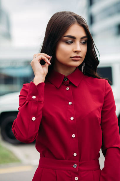 istock Woman with make up in red buttoned up dress. 1332449037