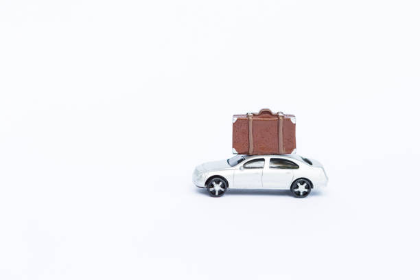 istock Model car with luggage toy isolate on white backgrund 1332450328