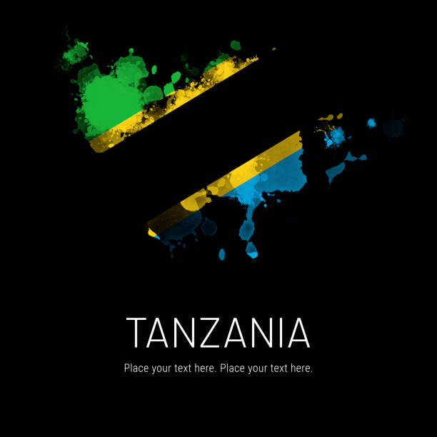 istock Tanzanian flag ink splat on black background 1332451338