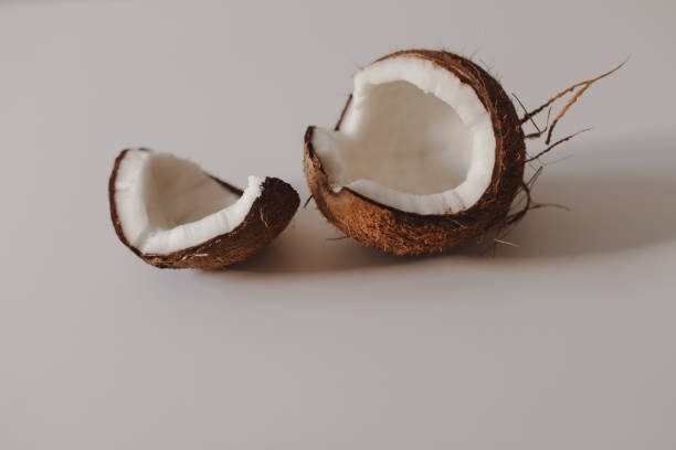 istock opened coconut pieces isolated on white background 1332451737
