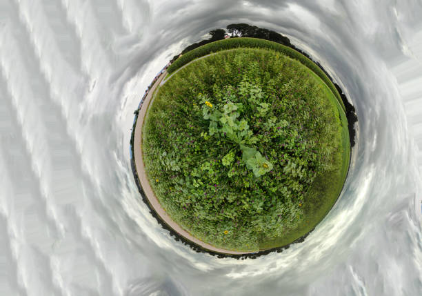 istock Imaginative spherical, abstract panoramic aerial view in a field with fantastic beautiful clouds and the curvature of space like a small planet 1332456989
