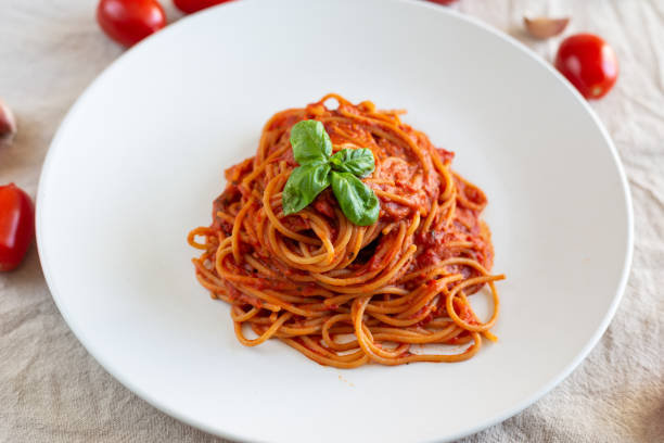 istock Italian spaghetti with tomato sauce, basil and extra virgin olive oil 1332465211