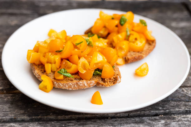 Friselle, bruschette with yellow tomatoes. Italian appetizer.