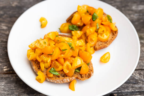 Friselle, bruschette with yellow tomatoes. Italian appetizer.